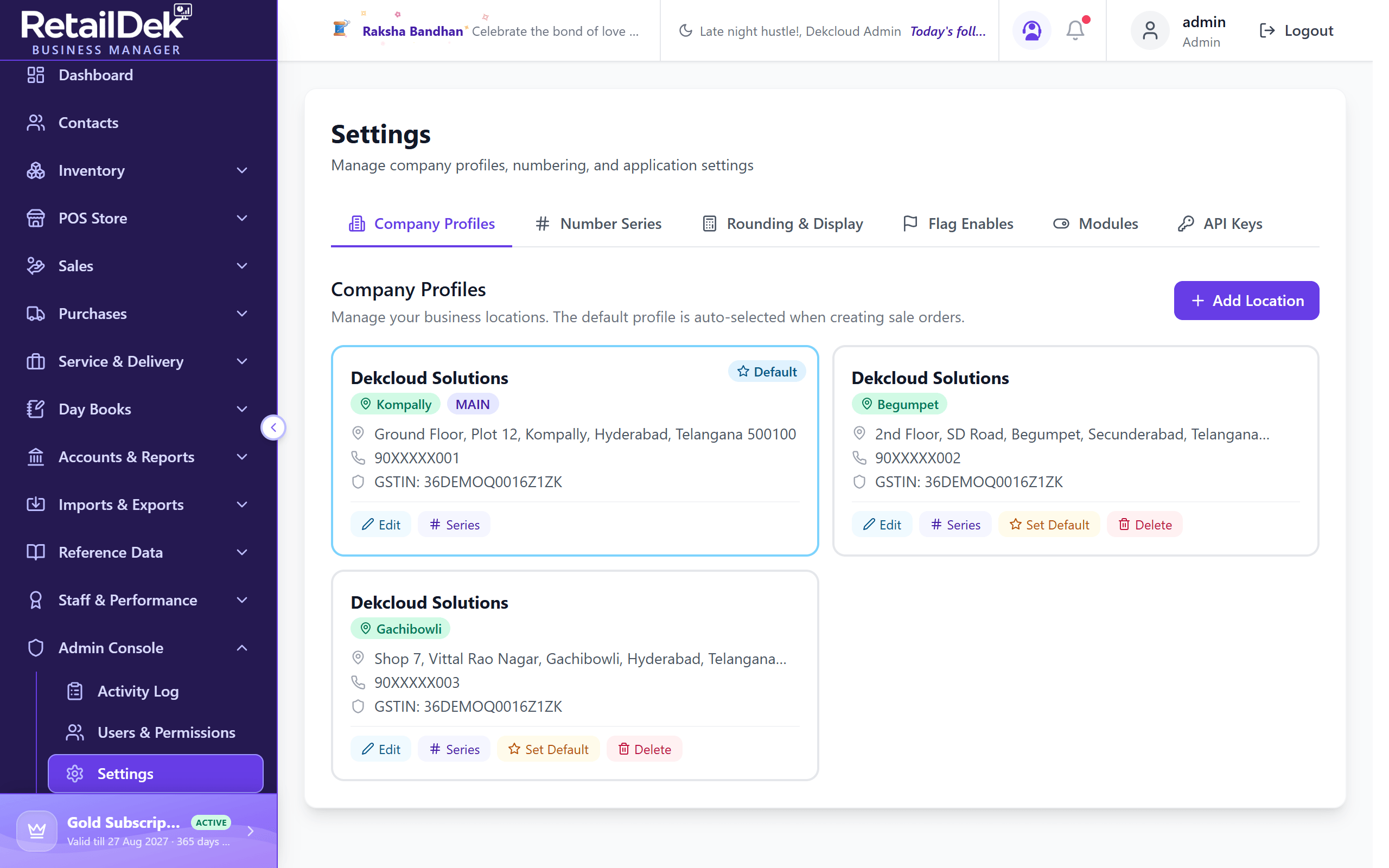 The Settings screen on the Company Profiles tab with store cards showing default badge, code, address, and GSTIN, and the tab bar above.